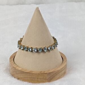 UCI Gold Tone Tennis Bracelet 7" Simulated Aquamarine Trillion Cut Stones